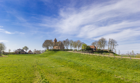 Little church on top of a mound in Hegebeintum, Netherlands