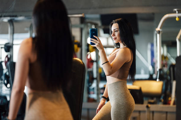 istock Young Woman Doing Exercises In The Gym 1363286735