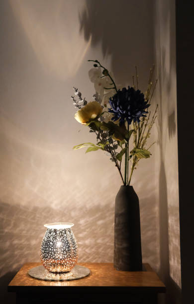 istock Flower vase in light shadow. Atmospheric, moody, modern interior design still life.design 1363286787