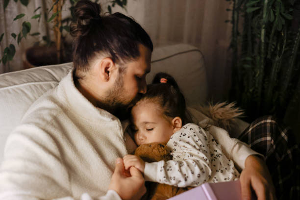 istock Young father and daughter taking a nap together 1363289708