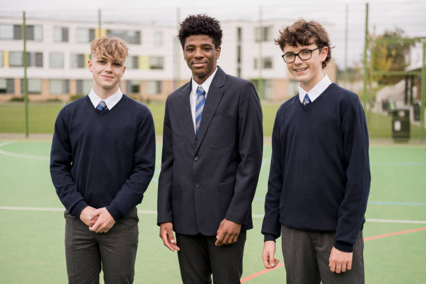 outdoor portrait of teenage schoolboys in uniforms - adolescence teenager high school student teenagers only imagens e fotografias de stock