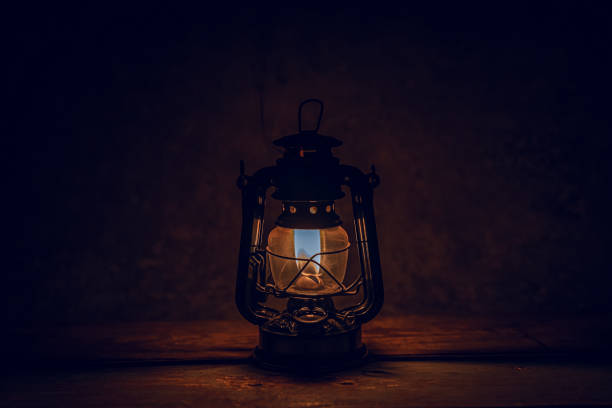 istock A Burning Kerosene Lamp On Wood Board Background 1363290077