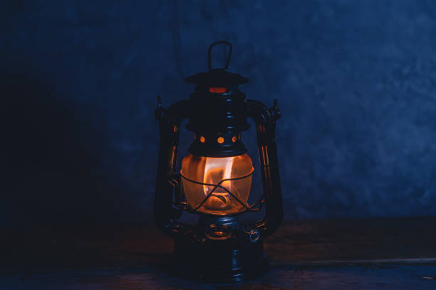 istock A Burning Kerosene Lamp On Wood Board Background 1363290079
