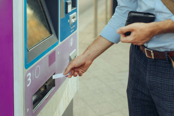 istock Man is withdrawing cash from an atm machine 1363290147