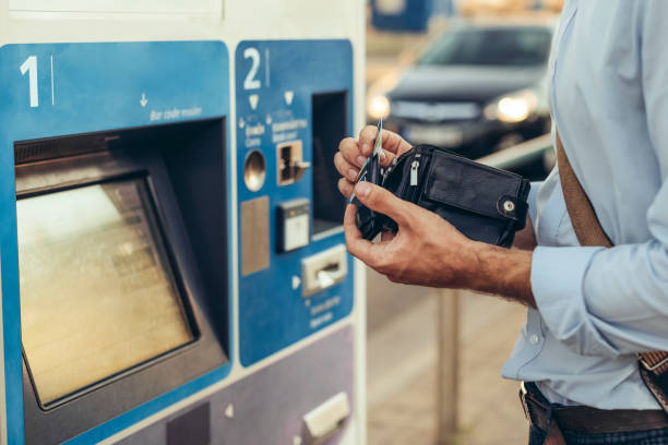 istock Man is withdrawing cash from an atm machine 1363290188