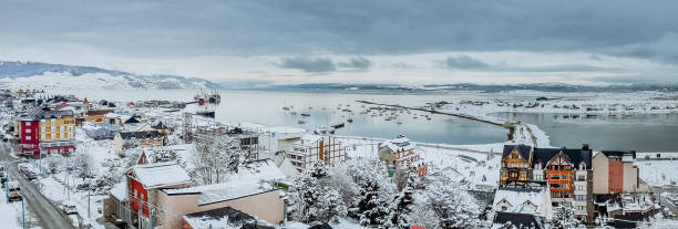 Ushuaia City in Winter View of the city of Ushuaia in winter season and the Beagle Channel in the background, Patagonia ushuaia photos stock pictures, royalty-free photos & images