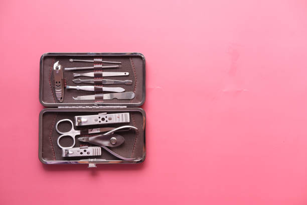 istock nail cutters for a manicure on red background 1363299143