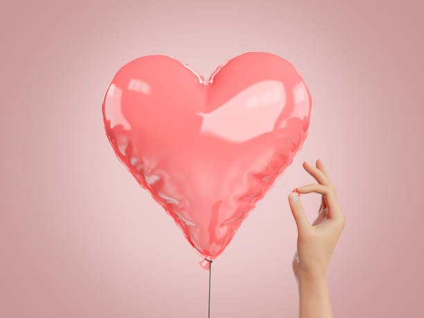 istock hand with a pin next to a heart shaped globe 1363299312