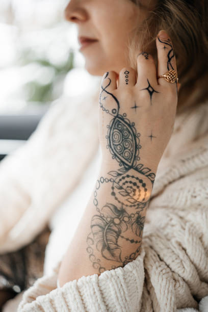 istock Unrecognisable young lady with painted hand sacral mehendi 1363300891