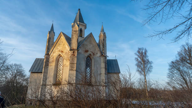 istock Neo-Gothic style chapel on sunset sky background. Religious concepts. 1363304065