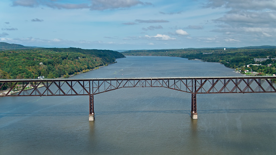 Drone shot of Walkway Over the Hudson, a former railway bridge converted into a pedestrian walkway across the Hudson River between Poughkeepsie and Highland in New York State.