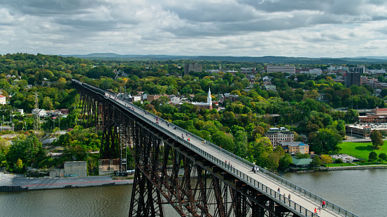 Drone shot of Walkway Over the Hudson, a former railway bridge converted into a pedestrian walkway across the Hudson River between Poughkeepsie and Highland in New York State.
