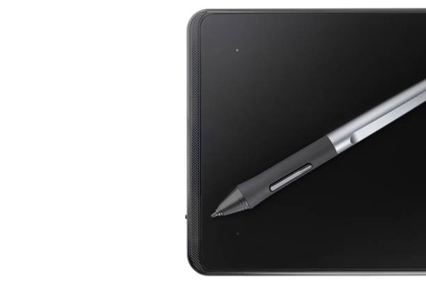 istock Graphic tablet on a white background. Graphic tablet and pen for retouching close-up. 1363306664