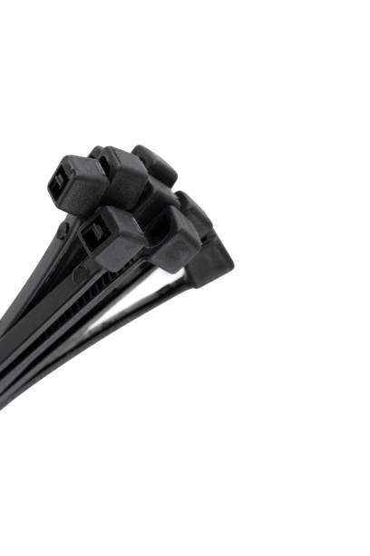 istock Tie clamps on a white background. Black plastic cable ties clamps close-up. 1363307516