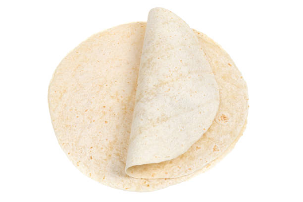 istock Tortilla on a white background. Thin flatbread close-up on a white background. 1363307596