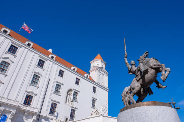 Bratislava Castle is the main castle of Bratislava, the capital of Slovakia. The massive rectangular building with four corner towers stands on an isolated rocky hill of the Little Carpathians directly above the Danube river in the middle of Bratislava. Because of its size and location, it has been a dominant feature of the city for centuries.