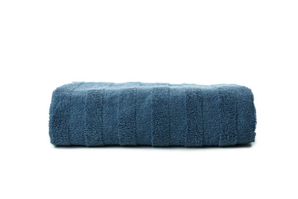 istock Blue folded towel isolated on white background 1363309597