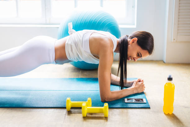 istock Sportive woman training at home 1363310181