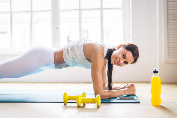 istock Sportive woman training at home 1363311259
