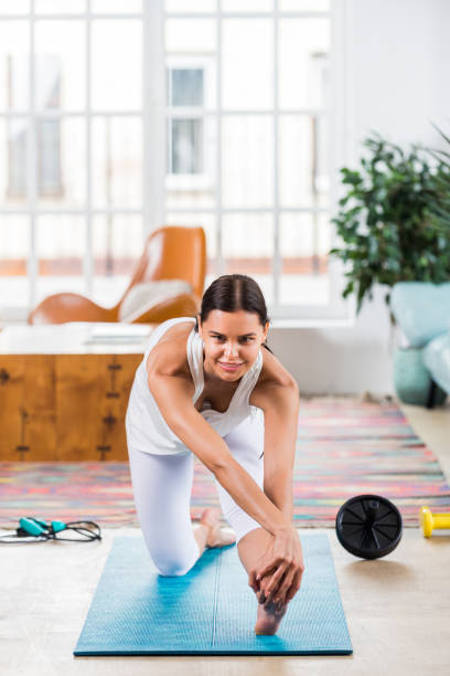 istock Sportive woman training at home 1363311492