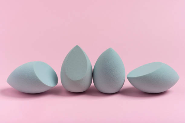 istock Blue cosmetic makeup set sponge on a minimal pink background. Tool for applying foundation cream 1363312571