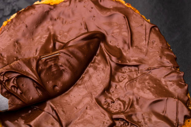 istock Spreading chocolate cream on toasted bread 1363314061