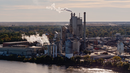 Aerial shot of a paper mill on the banks of the Savannah River in Port Wentworth, Georgia, part of a complex of industrial buildings around the Port of Savannah.

Authorization was obtained from the FAA for this operation in restricted airspace.