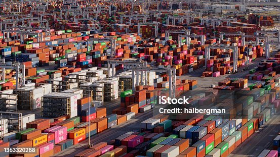 istock Lines of Straddle Carriers Loading Containers Onto Trucks in Port of Savannah 1363320288