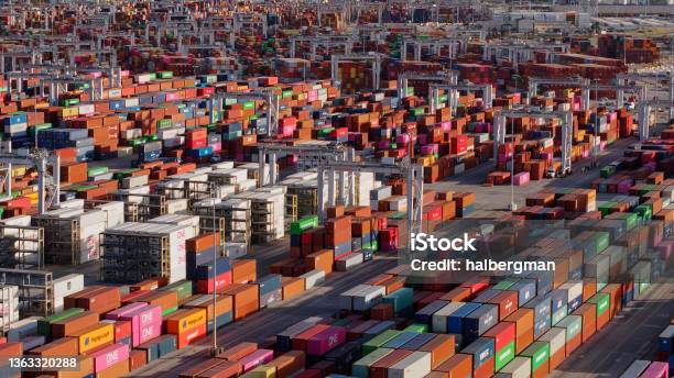 Lines Of Straddle Carriers Loading Containers Onto Trucks In Port Of Savannah Stock Photo - Download Image Now