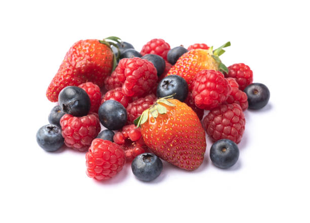istock Raspberries, strawberries and blueberries isolated over white background 1363324922
