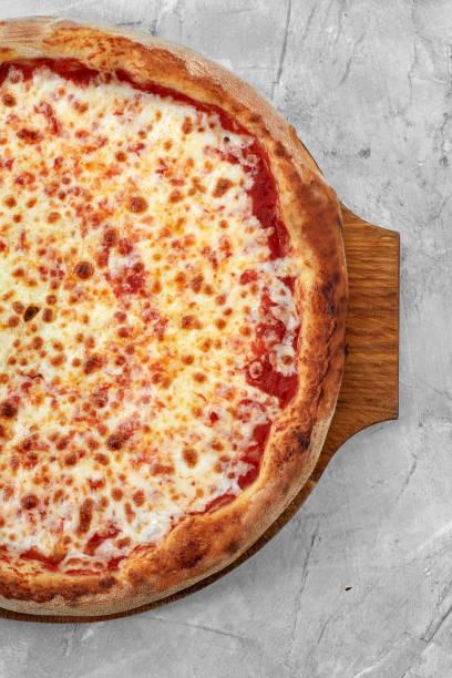 istock Selective focus traditional stone-baked pizza Margarita on stone table 1363325043