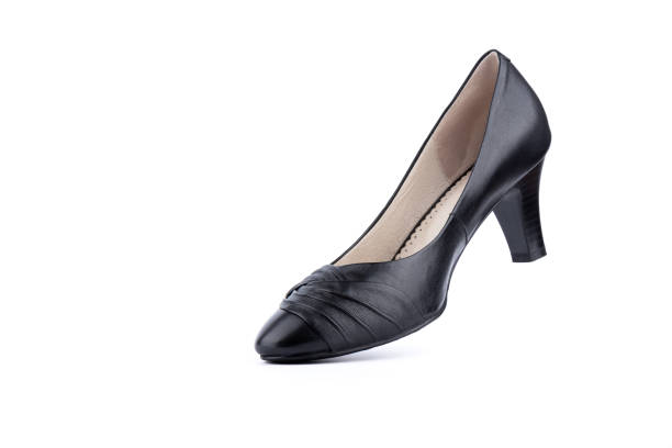istock Women's black leather shoes on a white background. 1363325945