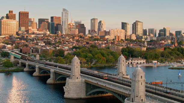 istock Red Line Trains Crossing on Longfellow Bridge at Sunset - Aerial 1363326074