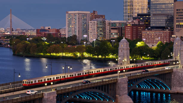 boston subway train on longfellow bridge at nightfall - aerial - boston sunset city bridge imagens e fotografias de stock