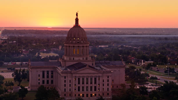 istock Sun Peeping Above Horizon Behind Oklahoma State Capitol Building - Aerial 1363328223