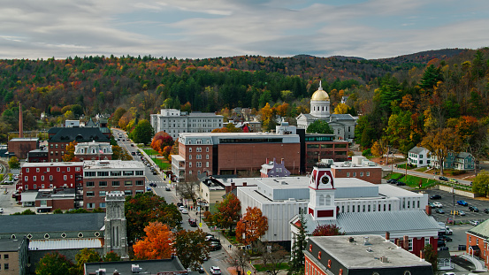 Aerial establishing shot of the state capitol building in Montpelier, Vermont in Fall, flying over downtown buildings with a mountainside covered in colorful autumnal trees behind. 

Authorization was obtained from the FAA for this operation in restricted airspace.