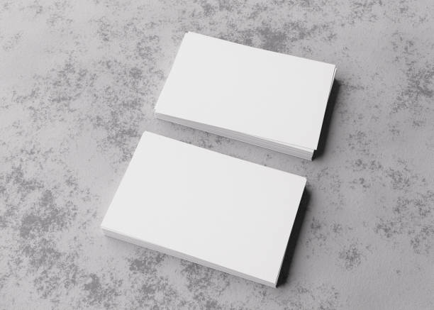 istock Blank white business cards on rough concrete surface. Mockup for branding identity. Two stacks, to show both sides of card. Template for graphic designers. Feee space, copy space. 3D rendering. 1363331173