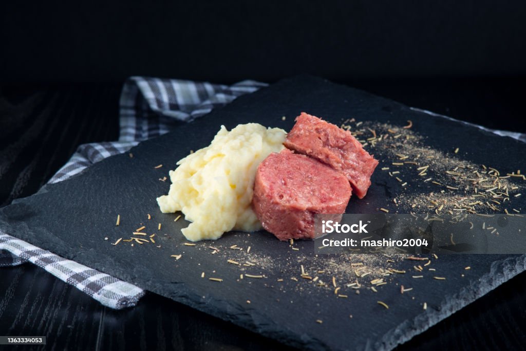 cotechino and mashed potatoes in the foreground Animal Body Part Stock Photo