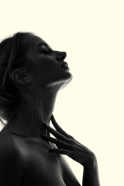 Profile of Woman in Silhouette stock photo