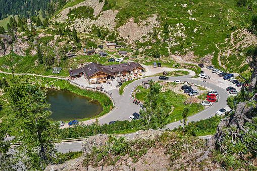 Castello-Molina di Fiemme, Italy - August 9, 2021: tourists enjoying a sunny day of summer at the Manghen Pass, a famous tourist destination in the Lagorai Mountain Range.