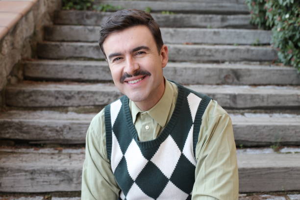 istock Man with a mustache wearing sleeveless rhombus sweater 1363334813