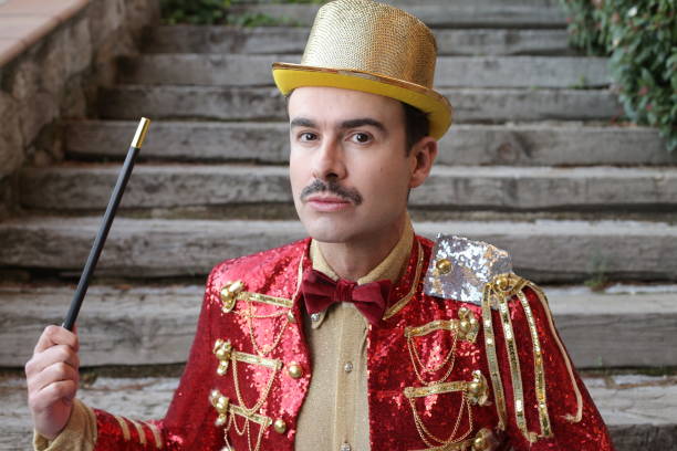 istock The greatest illusionist ever holding magic wand 1363334847