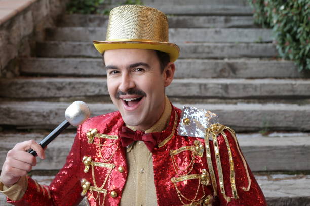 istock Elegant host wearing flashy outfit holding a microphone 1363334858