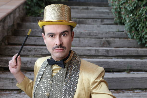 The greatest illusionist ever holding magic wand