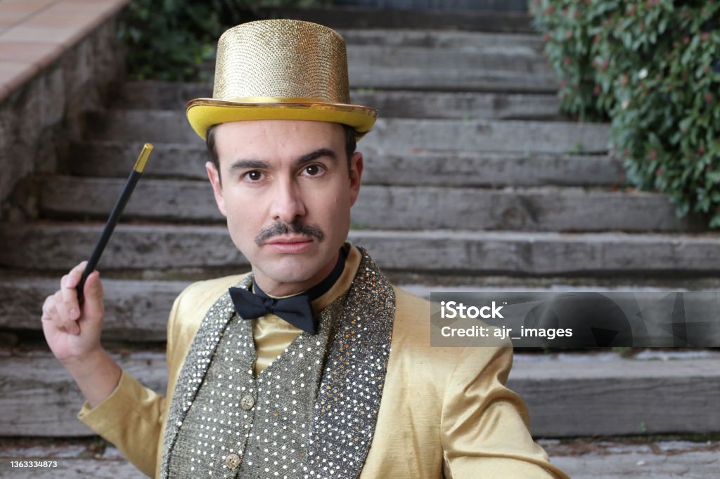 The greatest illusionist ever holding magic wand The greatest illusionist ever holding magic wand. Magic Trick Stock Photo