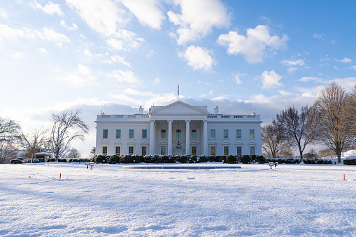 A horizontal photo of the north side of the White House blanketed in snow after a January snowstorm.