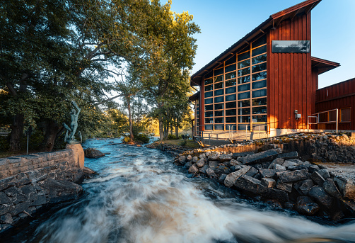 Morrum, Sweden - Aug 22, 2021: Mörrum salmon river at the Laxens hus (Salmon house) sportfishing center. \nLong exposure photo.