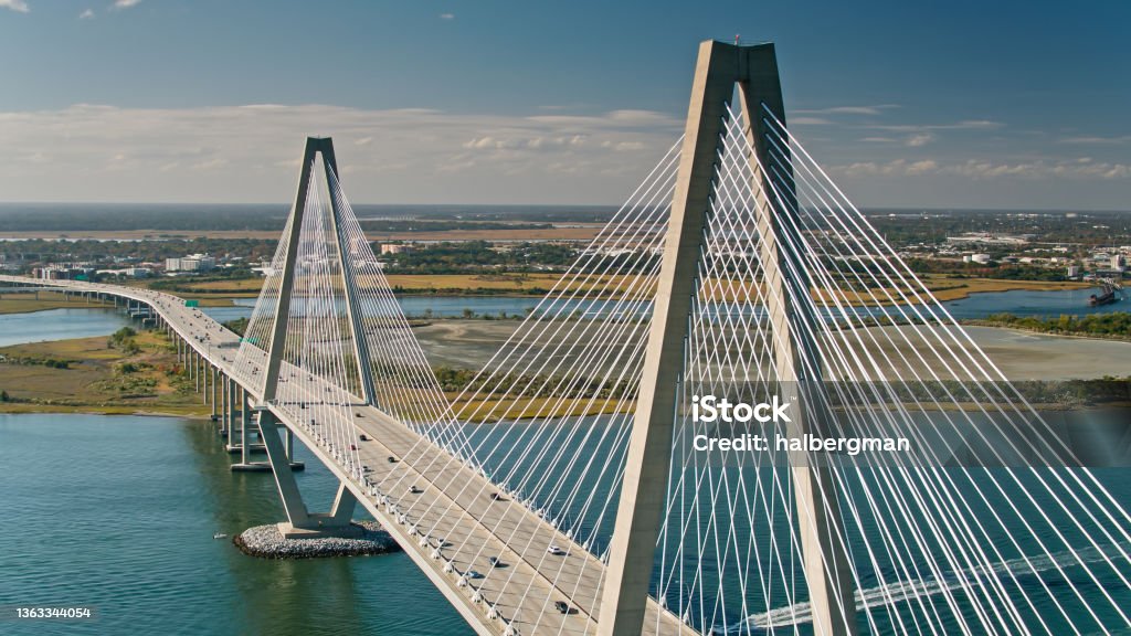 Drone Shot of Cooper River Bridge in Charleston, SC Drone shot of the Cooper River Bridge, officially the Arthur Ravenel Jr. Bridge, a cable-stayed bridge over the Cooper River in South Carolina, US, connecting downtown Charleston to Mount Pleasant. Charleston - South Carolina Stock Photo