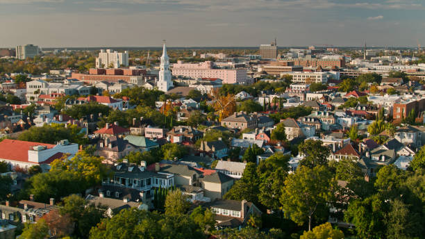 istock Drone Flight Over Colonial Houses in Charleston, SC at Sunset 1363344120