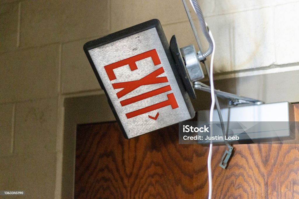 Abandoned Louisiana Prison Abandoned Louisiana Prison in the process of being torn down Exit Sign Stock Photo